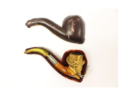 A 19th century Meerschaum pipe with silver collar, amber mouthpiece, and carved as a gentleman's head wearing a straw hat(cas