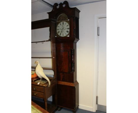 A 19th Century mahogany eight day longcase clock, the white enamelled dial having black Roman numerals, the dial inscribed 'K