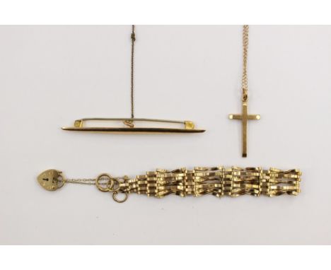 A collection of 9ct gold jewellery to include gate bracelet, a marquise shaped bar brooch and a gold cross on a fine chain, w