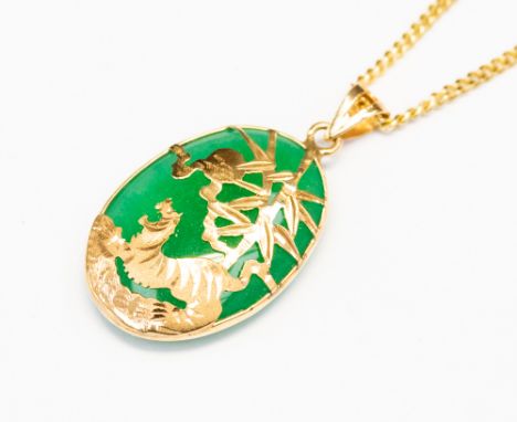 A 14k gold and jade pendant and chain, gross 7.9 grams approx 