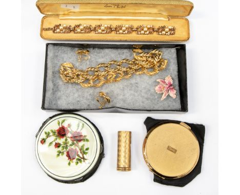 A 9ct gold and gilt Art Deco lipstick holder, a 1950s silver guilloche enamel compact having red rose on white enamel ground,