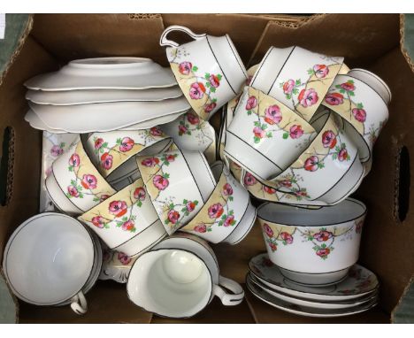 An early 20th Century Melba bone china hand painted teaset, comprising twelve cups, twelve saucers, twelve side plates, two b