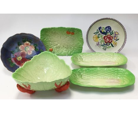 A Royal Doulton floral decorated bowl; together with a Poole pottery plate, a Carlton ware lobster and cabbage ware bowl and 