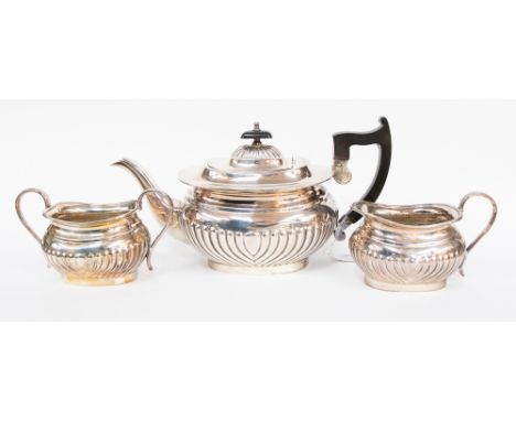 A Viners silver plated three piece tea service, in the Regency style, comprising teapot, milk jug and sugar bowl, the bodies 