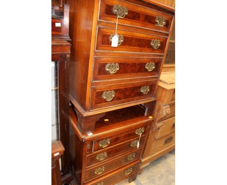 A pair of Georgian style walnut chest of drawers, comprising a Bachelors chest with fold-over top and lopers to sides and a m