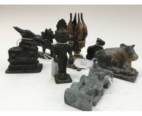 A collection of Indian bronzes including four faced Shiva, Lotus flower lamp and similar (7)
