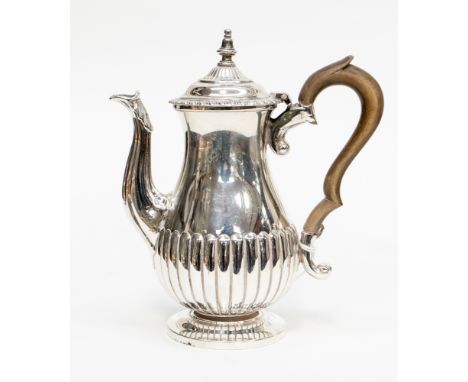 A silver miniature coffee pot, baluster form with wooden handle, London 1915, marks part rubbed, probably Carrington & Co, ap