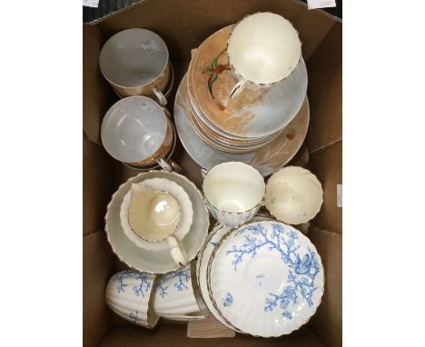 Two hand painted part tea sets including cups, saucers, milk jug, sugar bowl, and plates, one blue and white, two pieces a/f 