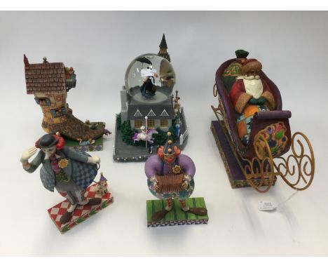 Jim Shore models of clowns, An Old Woman who Lived in a Shoe and a Santa on his sleigh; together with a Mary Poppins snow glo