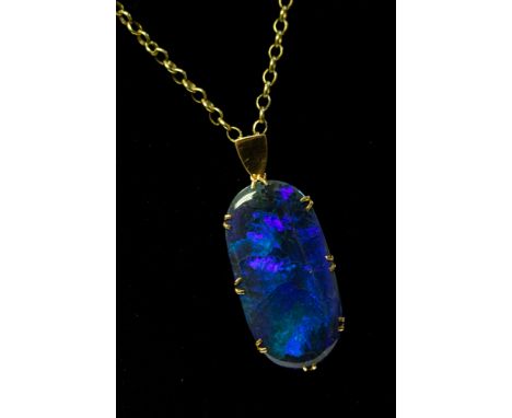  A large black opal pendant, a solid black opal showing blue and green play of colour, stone weight approx 25 carats, approx 