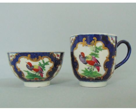 A Worcester Tea Bowl and A Worcester Coffee CupDecorated with 'Fancy Birds ' Pattern on a Blue scale GroundCirca  1765-70Size