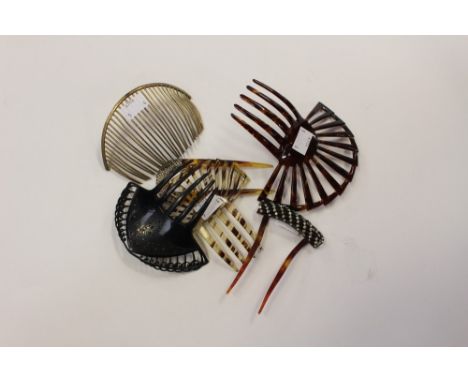 A collection of hair combs to include a bakelite fan shaped comb, a a black comb with tiny blue stones, a large brass metal c