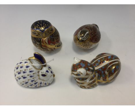 Four Royal Crown Derby paperweights: quail, owl, rabbit, (first quality), and cat, (seconds) 