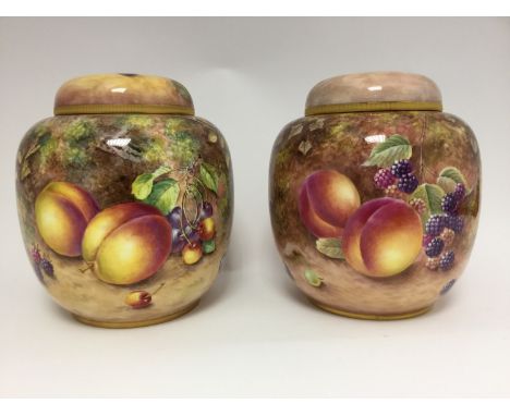 A pair of Royal Worcester ginger jars and covers, fruit painted, one signed Freeman, one signed N. Creey, ref: 2826 