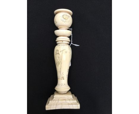 Masonic Interest: A turned and carved ivory candlestick, 19th Century, carved all over with Masonic symbols, the candlestick 