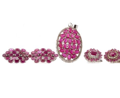 SUITE OF TREATED RUBY JEWELLERY, comprising two bracelets, pendant and two pairs of earrings, each in silver
