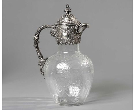 A VICTORIAN SILVER-MOUNTED CLARET JUG, JOHN ALDWINCKLE AND THOMAS SLATER,LONDON, 1893 The hinged gadrooned cover applied with