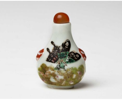 A CHINESE FAMILLE ROSE â€˜BUTTERFLYâ€™ SNUFF BOTTLE, QING DYNASTY, 19TH CENTURY The pear-shaped body on an oval foot rising t