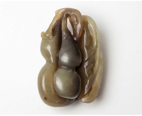 A CHINESE JADE 'DOUBLE GOURD AND LINGZHI' CARVING, QING DYNASTY, LATE 19TH CENTURY The double gourd carved to the reverse wit