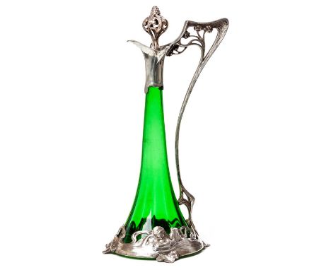 AN ART NOUVEAU WMF SILVER ON PEWTER GREEN GLASS CLARET JUG, EARLY 1900s The mount depicting bathing maidens, the finial and h
