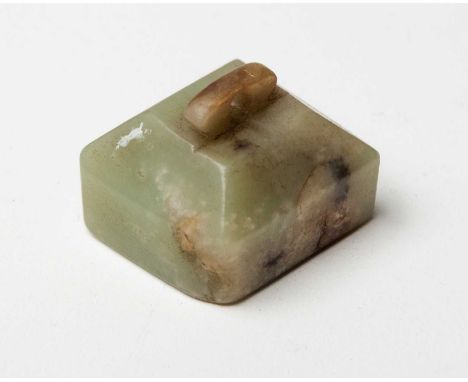 A CHINESE CELADON JADE SEAL, QING DYNASTY, 19TH CENTURY The square seal rising to conical sides surmounted by a pierced suspe