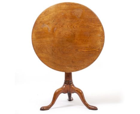 A GEORGE III MAHOGANY CIRCULAR TILT TOP TABLE with a bird cage support, turned column and a tripod base, 74cm diameter x 71cm