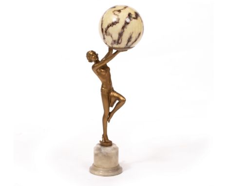 AN ART DECO TABLE LAMP in the form of a gilt spelter semi-nude maiden holding a globe aloft, mounted on a turned alabaster pl