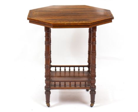 A VICTORIAN ROSEWOOD OCTAGONAL CENTRE TABLE with decorative floral inlay to the top, ring turned legs and a galleried underti