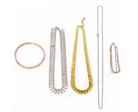 A YELLOW METAL BANGLE  marked 9 carat, 7.5cm diameter; a yellow metal necklace and a white metal necklace