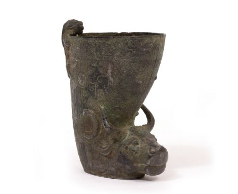 AN ARCHAIC BRONZE OF BULL HEAD FORM, 17.5cm high