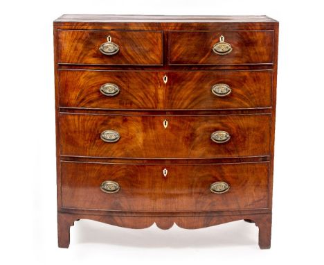 AN EARLY VICTORIAN MAHOGANY BOW FRONT CHEST OF TWO SHORT AND THREE LONG DRAWERS the brass handles with embossed anchors, all 