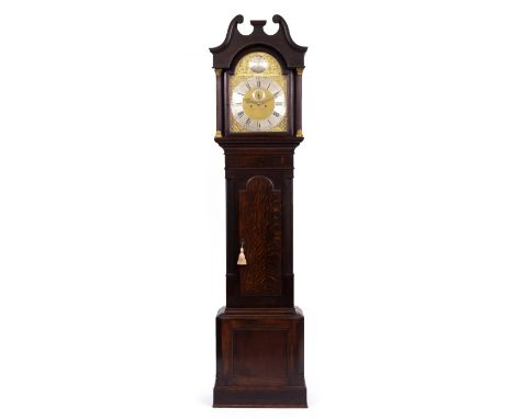 AN OAK LONGCASE CLOCK the brass and silver dial with a subsidiary second hand and arabic and roman numerals, overall 58cm wid