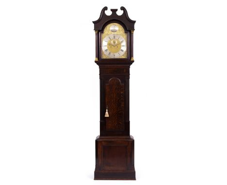 AN OAK LONGCASE CLOCK the brass and silver dial with a subsidiary second hand and arabic and roman numerals, overall 58cm wid