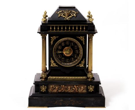 A LATE 19TH CENTURY SLATE MANTLE CLOCK with gilt column supports, the slate dial with gilded arabic numerals above a gilded p