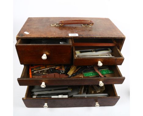 A Vintage watchmaker's table-top tool chest, containing a quantity of wristwatch straps 
