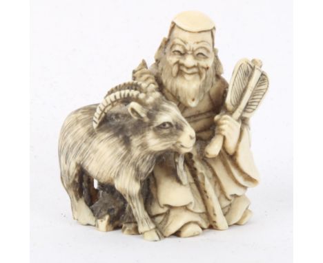 A Japanese carved ivory netsuke, shepherd with goat, signed, height 4cm 