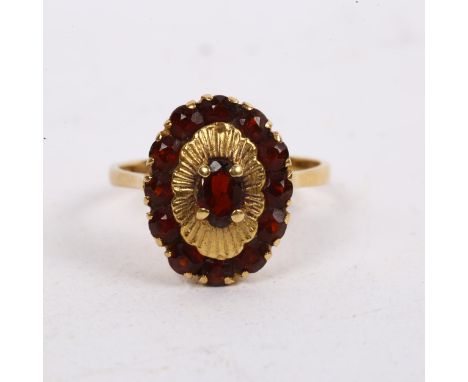 An 18ct gold garnet oval cluster ring 