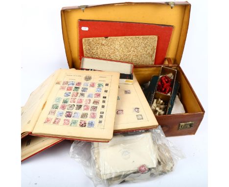 A case containing playing cards, chessmen, stamps etc 