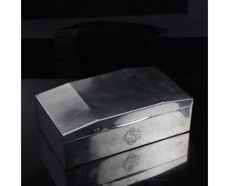 An Art Deco rectangular silver cigarette box, canted lid with engine turned decoration, 17cm x 9cm 