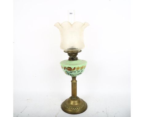 A mid-20th century brass column oil lamp, with painted green glass font and frosted shade, overall height 64cm 