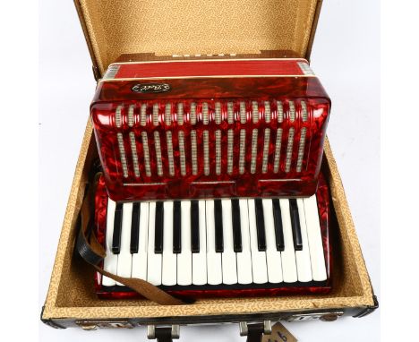 A Bell piano accordion, width 31cm, in case 
