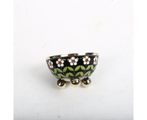 A small Russian silver and champleve enamel salt cellar, daisy decoration, with marks to base, diameter 5cm 