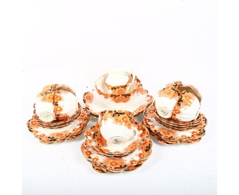 Early Paragon China tea service for 10 people, with shaped edges and stylised floral decoration 