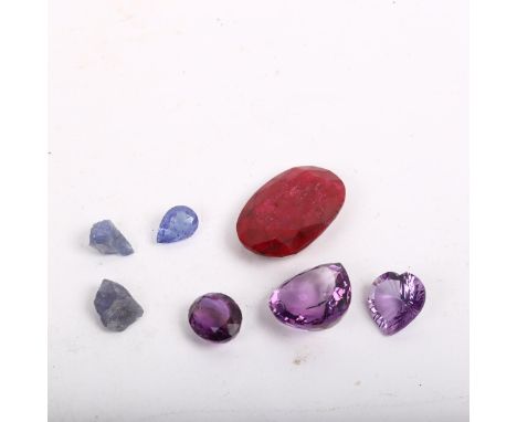Various unmounted gemstones, including ruby, amethyst, tanzanite etc 