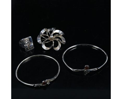 2 sterling silver amber bangles, a Danish silver brooch, and a Niels Erik From ring (4) 