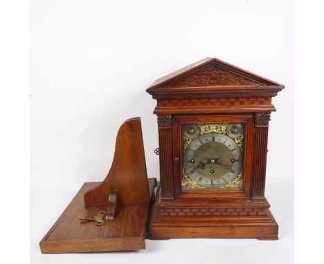 An early 20th century German oak architectural 8-day chiming bracket clock, brass dial with silvered chapter ring, blued stee