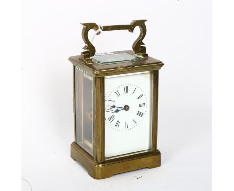 A brass-cased carriage clock, white enamel dial with Roman numeral hour markers, case height 11cm, not seen working, no key 