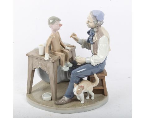 A large Lladro porcelain figural puppet painter group, Geppetto painting Pinocchio, model no. 5396, height 24cm 