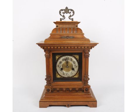 A German light oak architectural 8-day bracket clock, brass dial with silvered chapter ring, Arabic numerals and movement str