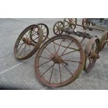 Set of four matching cast wheels on axles. Suit shepherds hut.